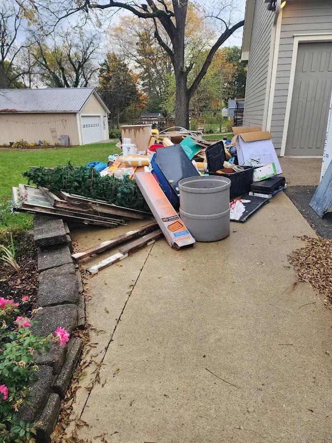 Dumpster being loaded with debris for Commercial Dumpster Rental in Sky Lake